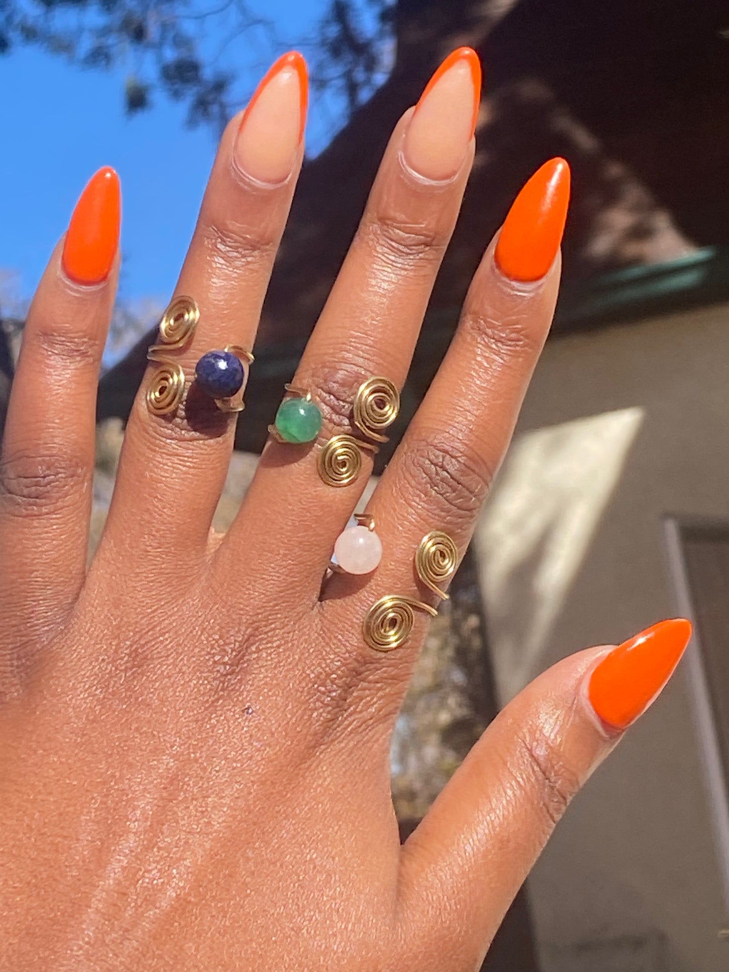 Double spiral gemstone ring